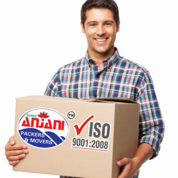 Young Man Carrying a Cardboard Box - Isolated